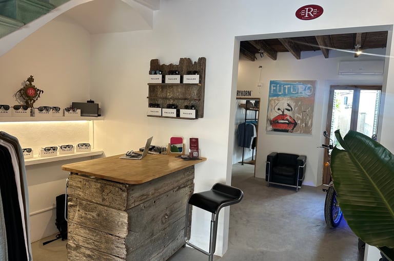 a kitchen with a bar stool and a bar stool