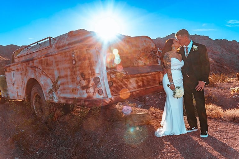wedding couple kiss sunset at nelson ghost town