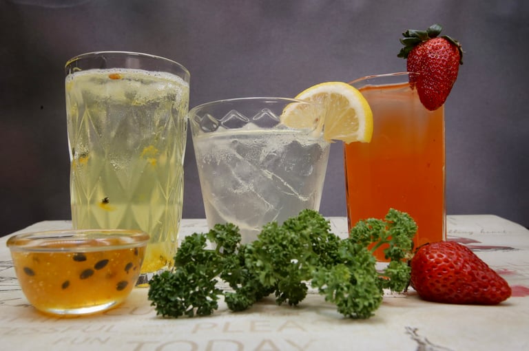 a variety of cocktail drinks on a table