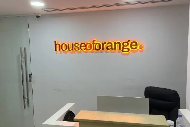 House of orange indor 3D acrylic backlit signage mounted on wall