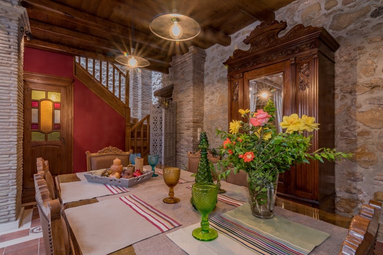 Dining area for up to 6 guests with vintage furniture in traditional stone house Villa Galanoussa
