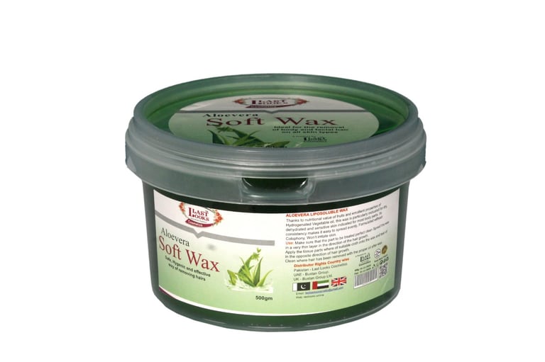 a jar of green tea leaves on a white background