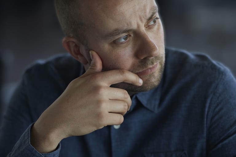 Man looking worried or fearful.