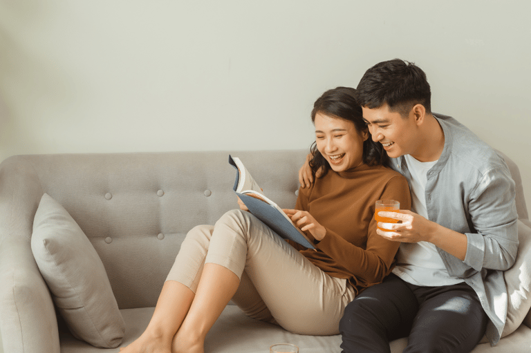 a man and woman sitting on a couch connecting through quality time