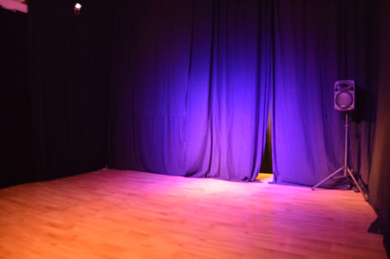 a stage with a speaker and a speaker