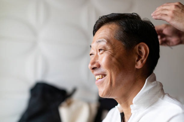 smiling man receiving hair assessment