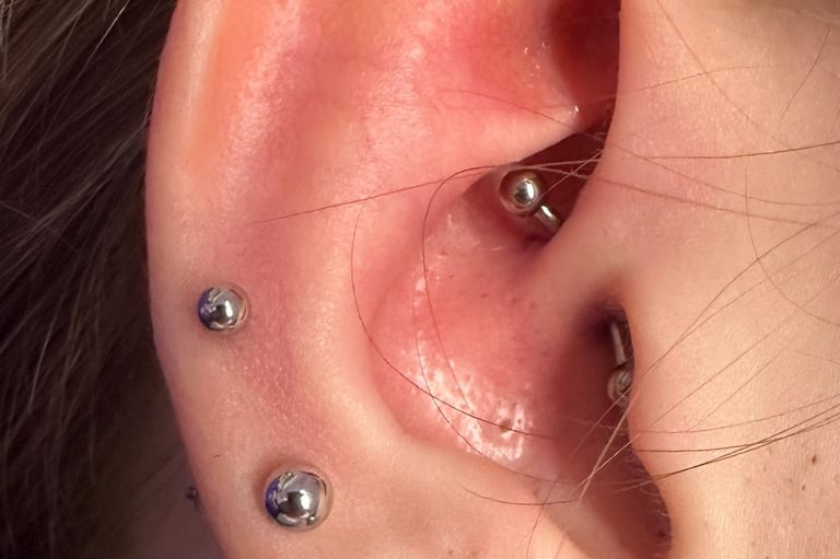 Close-up of a daith piercing with titanium barbell at Piercing by Jooles Montrose