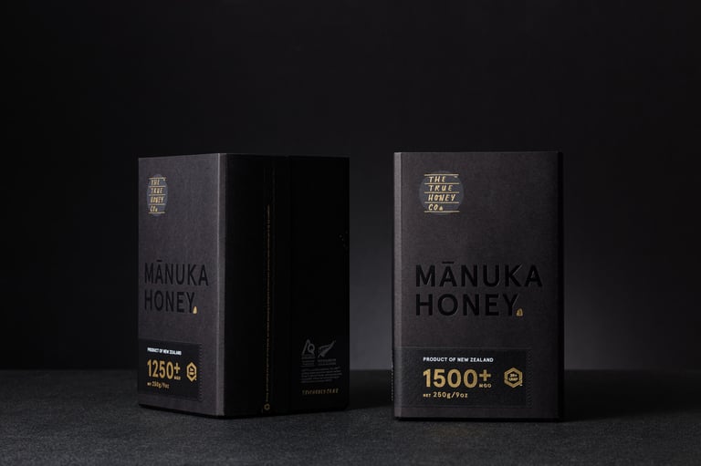 Product photography - two boxes of honey on a black background