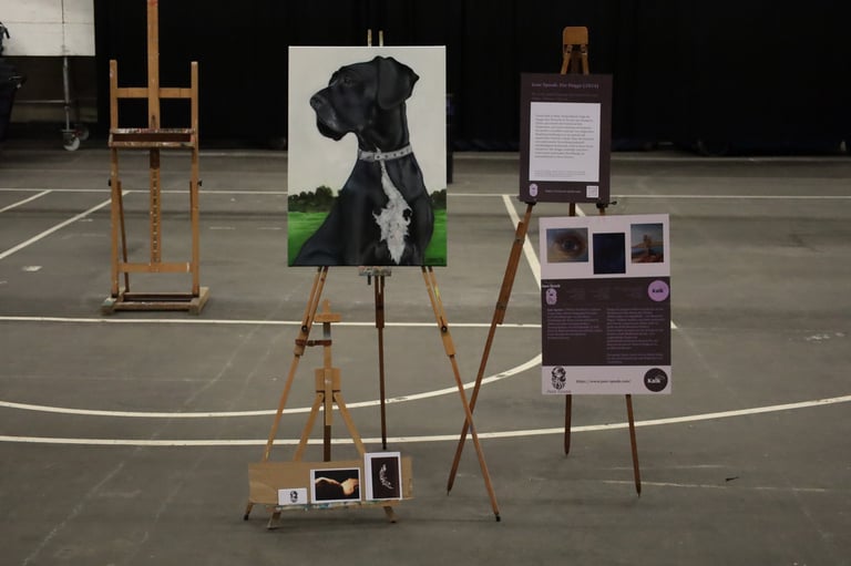 An oil painting of a black Great Dane on an artist easel in a gallery studio.