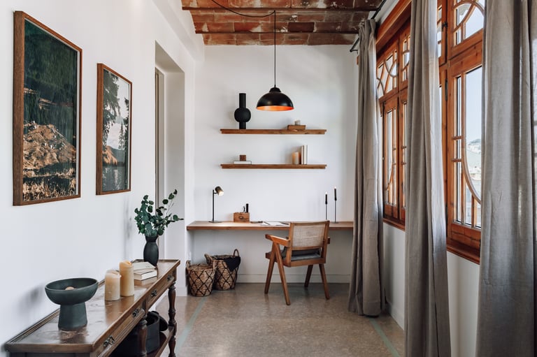 Rustic elegant working area design with wooden elements and art and big windows in Barcelona