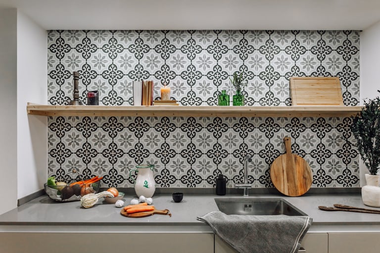 Open-plan kitchen with patterned tiles, neutral tones in Rute apartment interior design