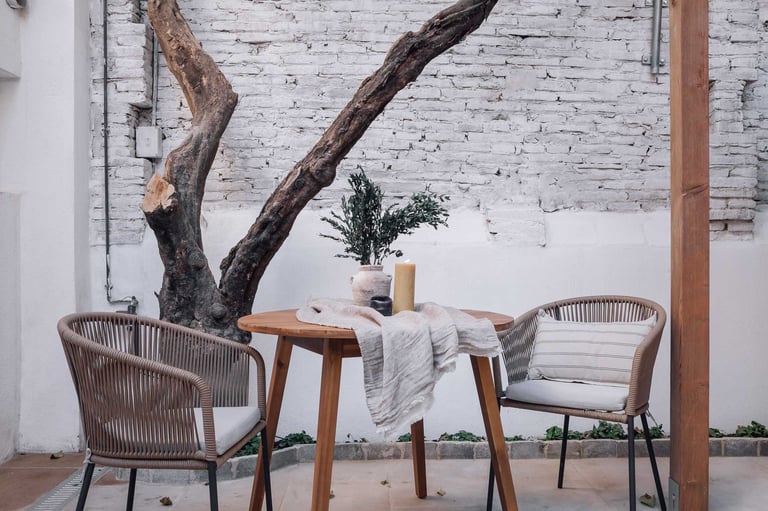 Outdoor terrace with seating, offering a serene atmosphere in Barcelona apartment