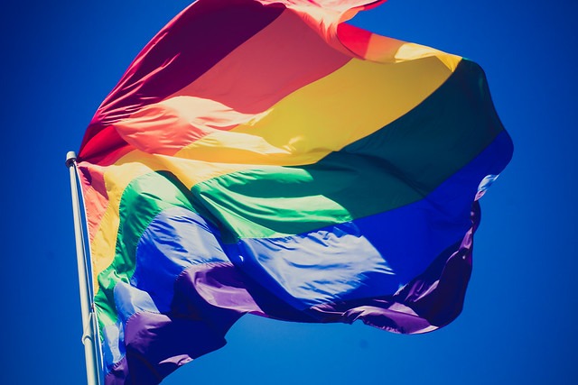 a rainbow - colored flag with a rainbow - colored flag