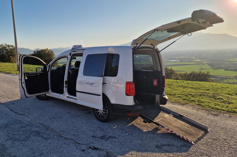 White wheelchair accessible taxi with ramp in Kavala - Orange Taxi disability transfers