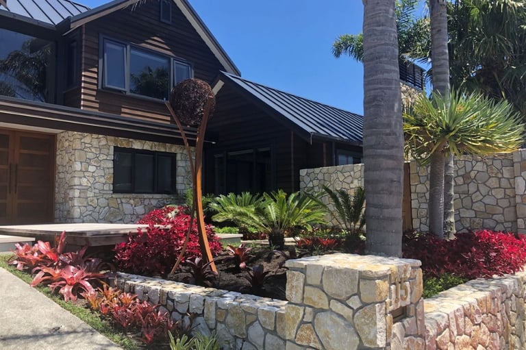 two storye reclad resort style home, natural stone, cedar stained weatherboards, tray style roof