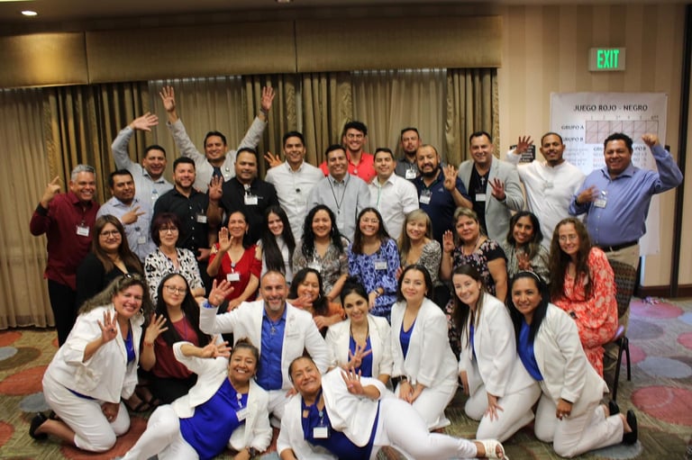 A diverse team of professionals posing for a group photo at a corporate networking event.