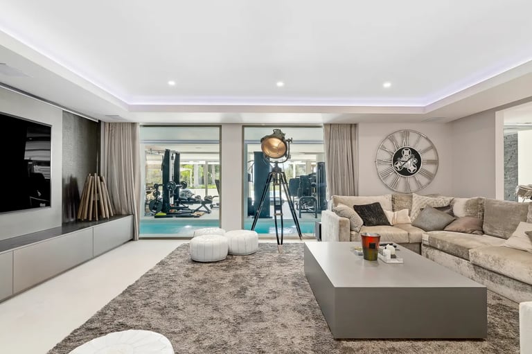 Villa Serenity TV room with large sofa and spa views