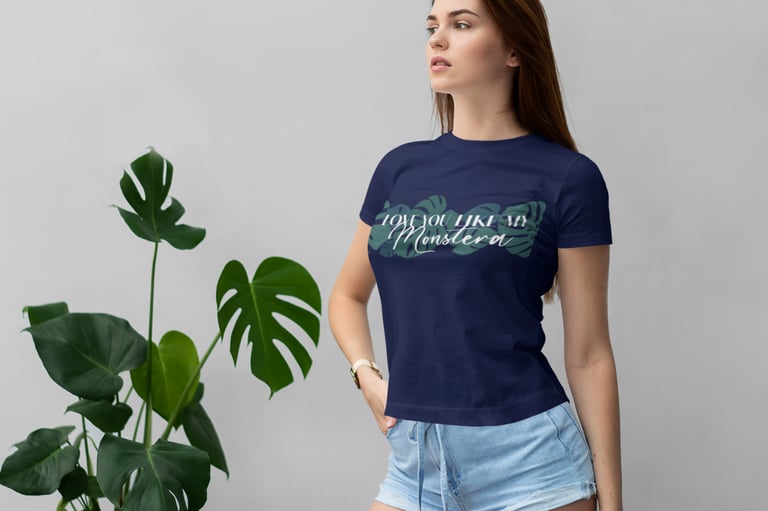 Woman wearing a plant-themed T-shirt styled with botanical accents — Miss Chatty Plants apparel.