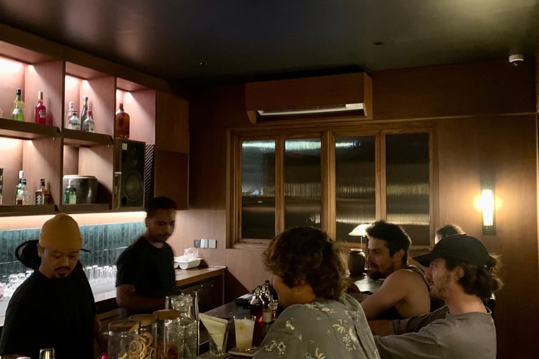 Kenji Ramen Bali Padang Linjong hidden bar guests enjoying craft cocktails - intimate Canggu