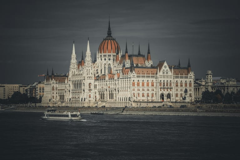 Hungarian Parliament building in Budapest along the Danube River at sunset