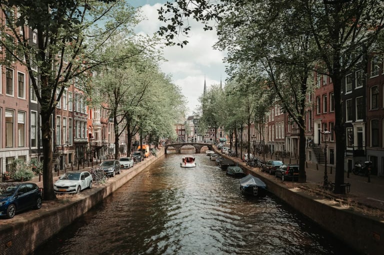 Amsterdam canals with historic buildings and reflections in water