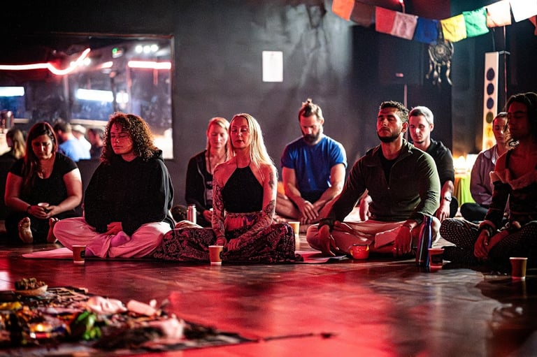 a group of meditators sat on the floor meditating
