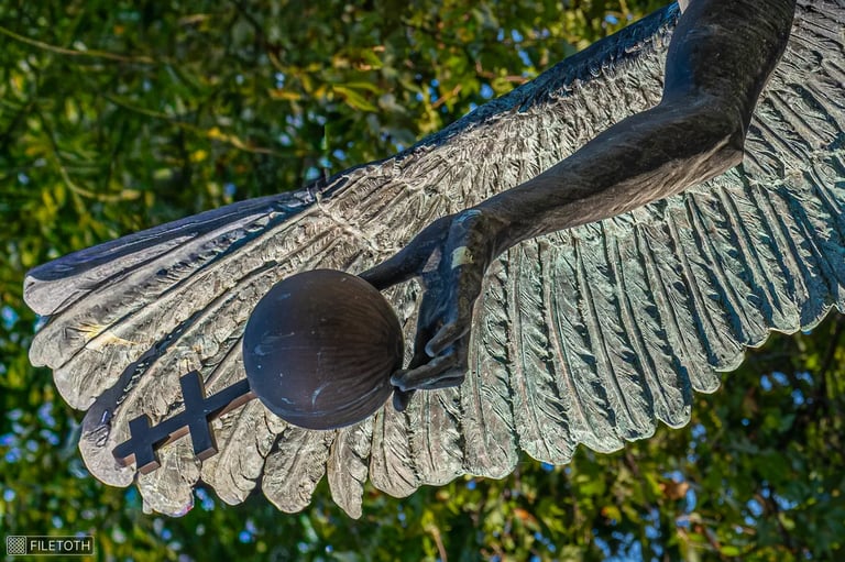 Close-up of Archangel Gabriel’s bronze hand as the state orb slips from his grasp.