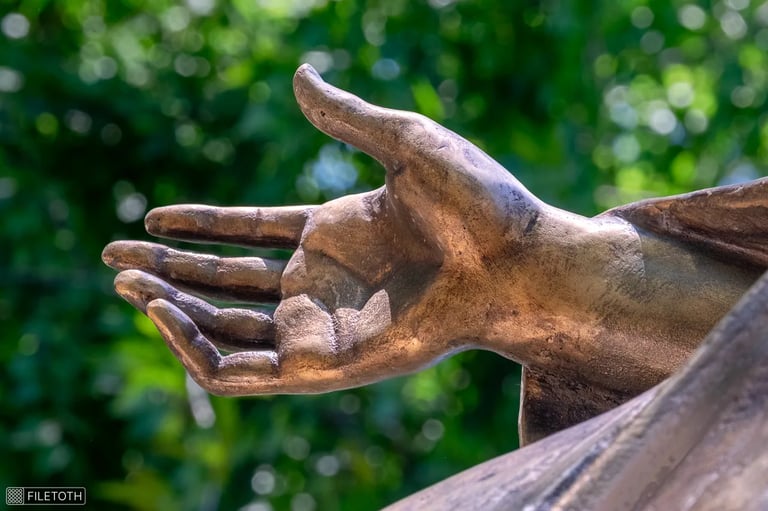 Saint Barbara’s protective hand, fingers gently curved in a guarding gesture.