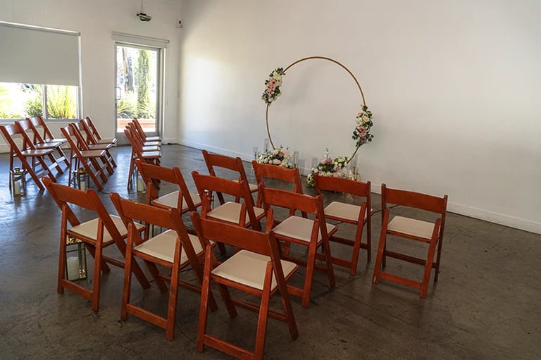 a room with chairs and chairs and a table