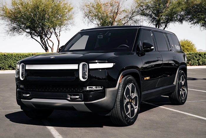 a black suv parked in a parking lot