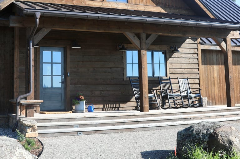 a porch with rocking chairs