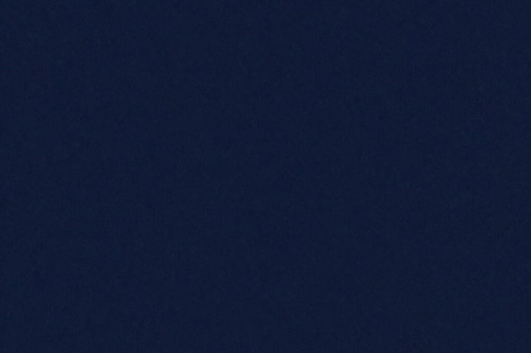 A solid dark navy blue background with a subtle matte texture.