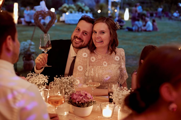 Bride and groom during reception light by candles.