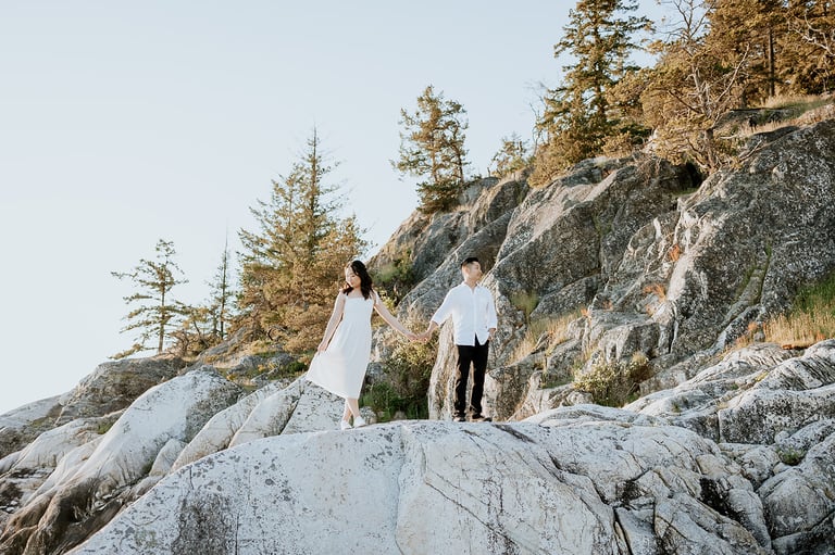 Light house park Engagement photos couple holding hands