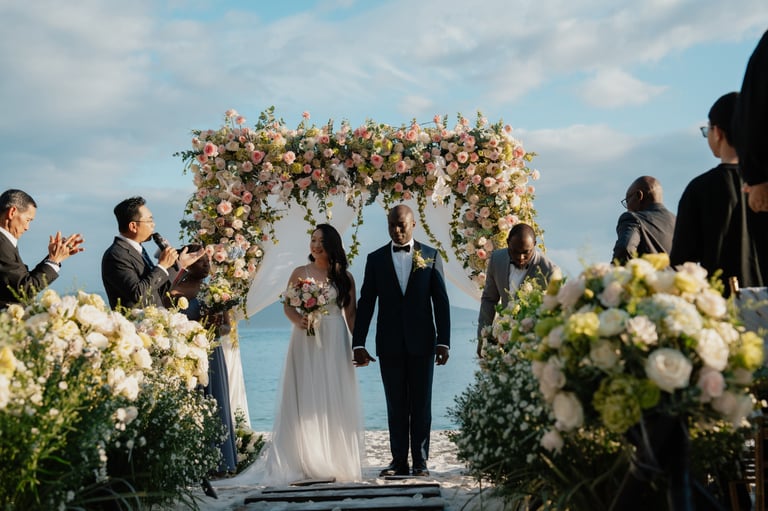 a bride and groom walking down the aisle of a wedding ceremony