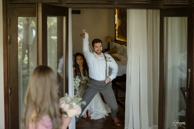 a man in a suit and tie is dancing with his arms up