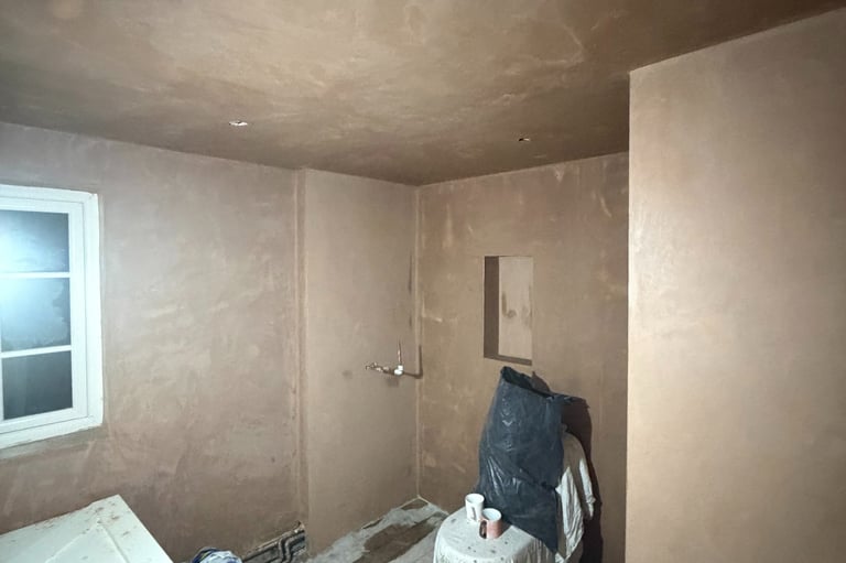 Skimming completed leaving smooth ceiling and walls ready for bathroom refit and decoration.