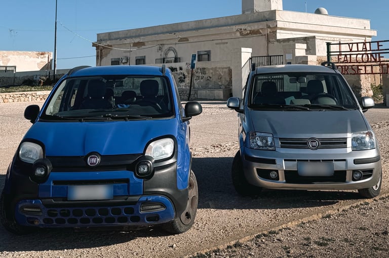 two cars parked in front of a building