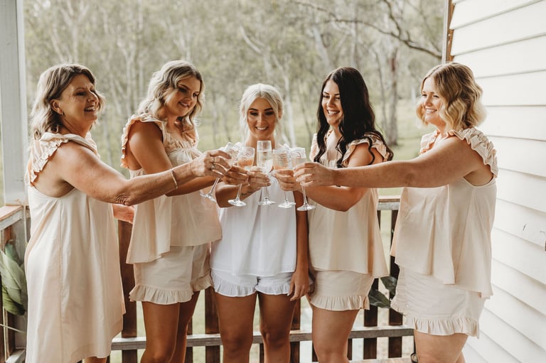 a group of women who are holding champagne flutes