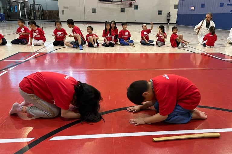 kids bowing to each other in calgary aikido class