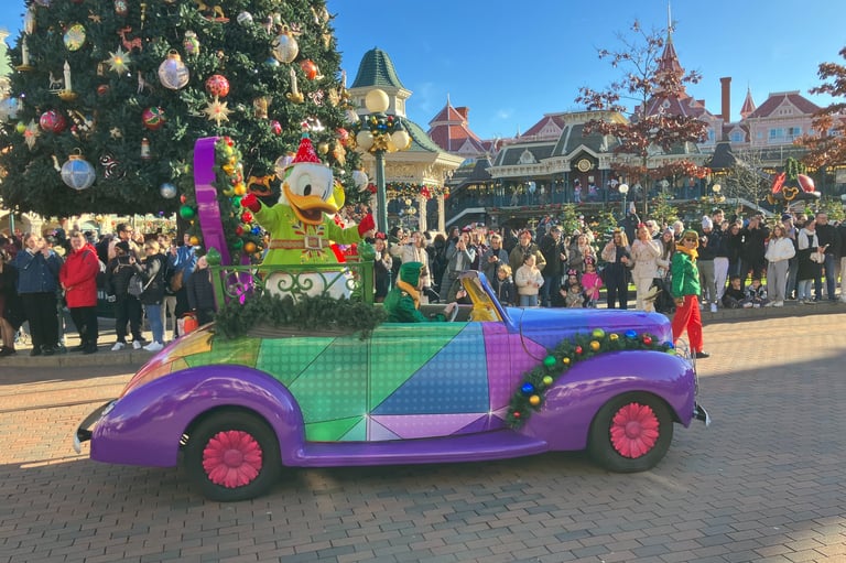 Donald Duck driving his car at Disney stars on parade show at Christmas time in Disneyland Paris 