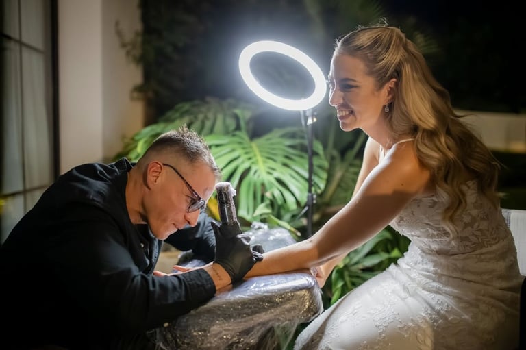 Cuart Ink providing a live wedding tattoo experience for a bride in marbella villa