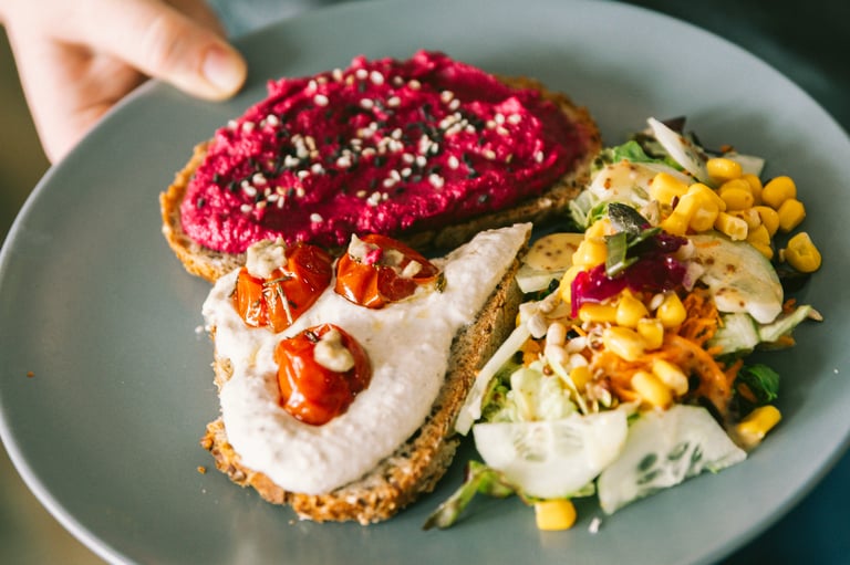 Savory plate with gourmet toast and a fresh salad.