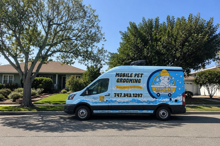 Fluff N Go mobile dog grooming van parked in a Los Angeles suburb neighborhood