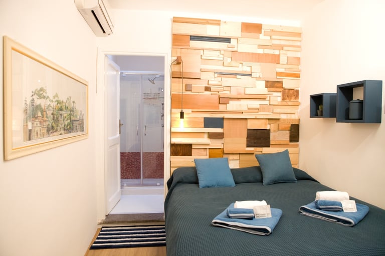 Comfortable bed in a Rome holiday apartment at Studio Paolina 2