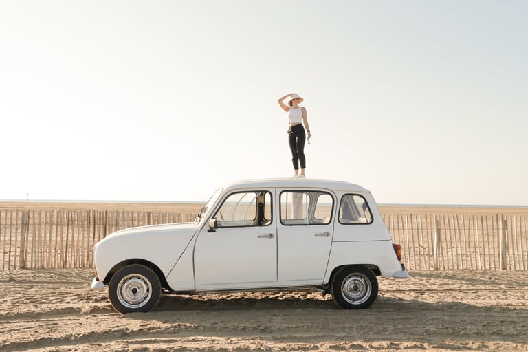 a woman standing on top of a car