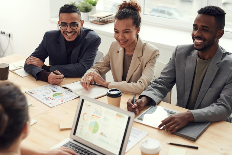 a group of people sitting around a table