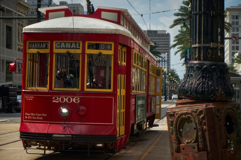 In New Orleans USA, a red trolley car on a city street