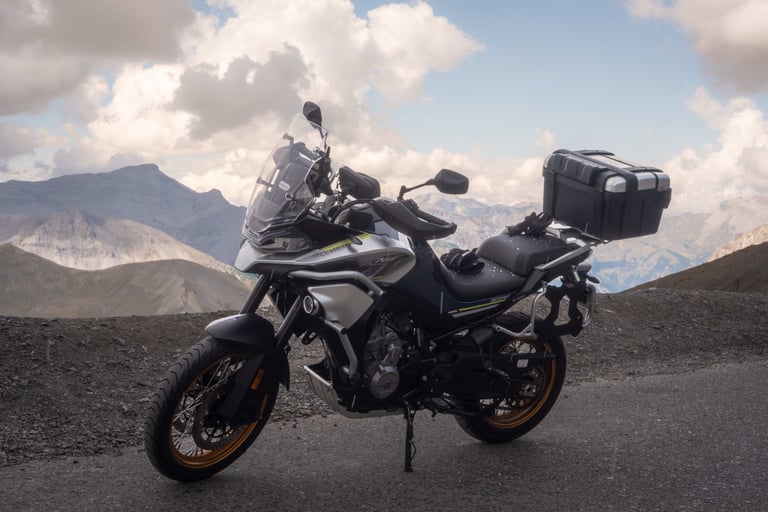 a motorcycle parked on a mountain side