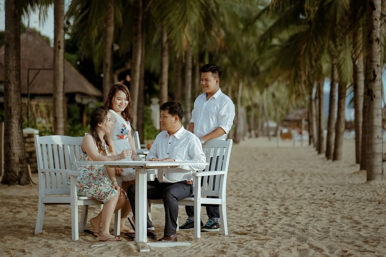 a family sitting at a table with a man and woman